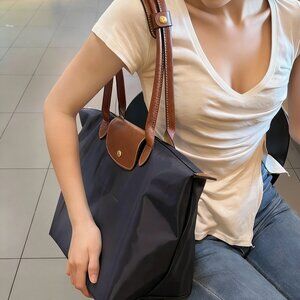 Longchamp Le Pliage folding tote bag, large size, black and brown.
